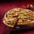 Kaiser Delicious Crossini Pizzaform 37 x 35 x 2,5 cm, Blech rund, Pizzablech antihaftbeschichtet, gewellter Thermoboden - 2