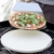 Rustler Pizzastein-/ Brotbackstein ø38 cm mit Edelstahl-Gestell + Pizzaschieber aus Edelstahl | für Pizza, Flammkuchen & Brot | für Backöfen, Holzkohle- und Gasgrills geeignet | in Geschenkverpackung - 3